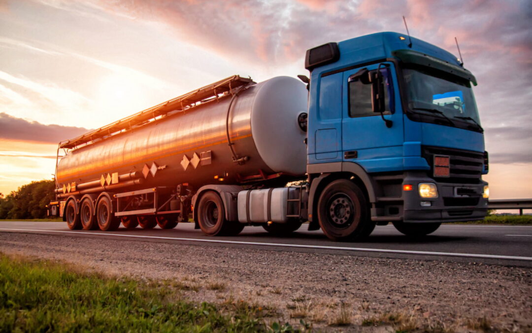 A tanker truck transporting oil domestically, displaying its importance.